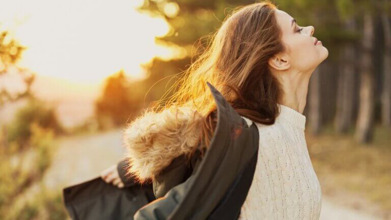 Woman breathing fresh air outside