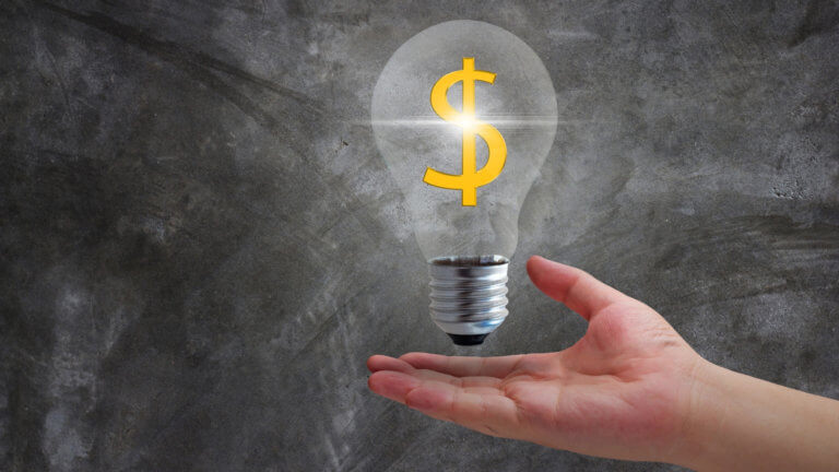 light bulb floating over hand