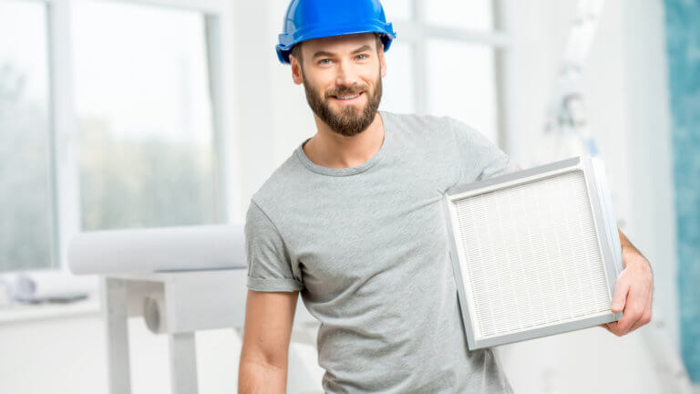 Man holding hvac filter
