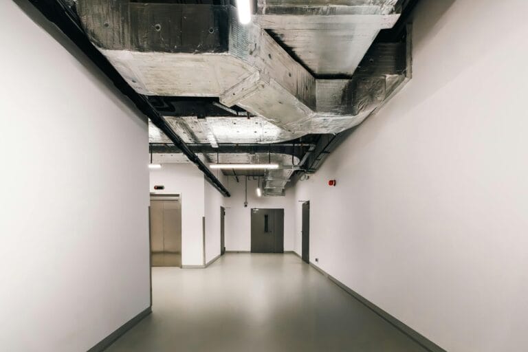 This commercial space has HVAC ductwork running above the hallway.